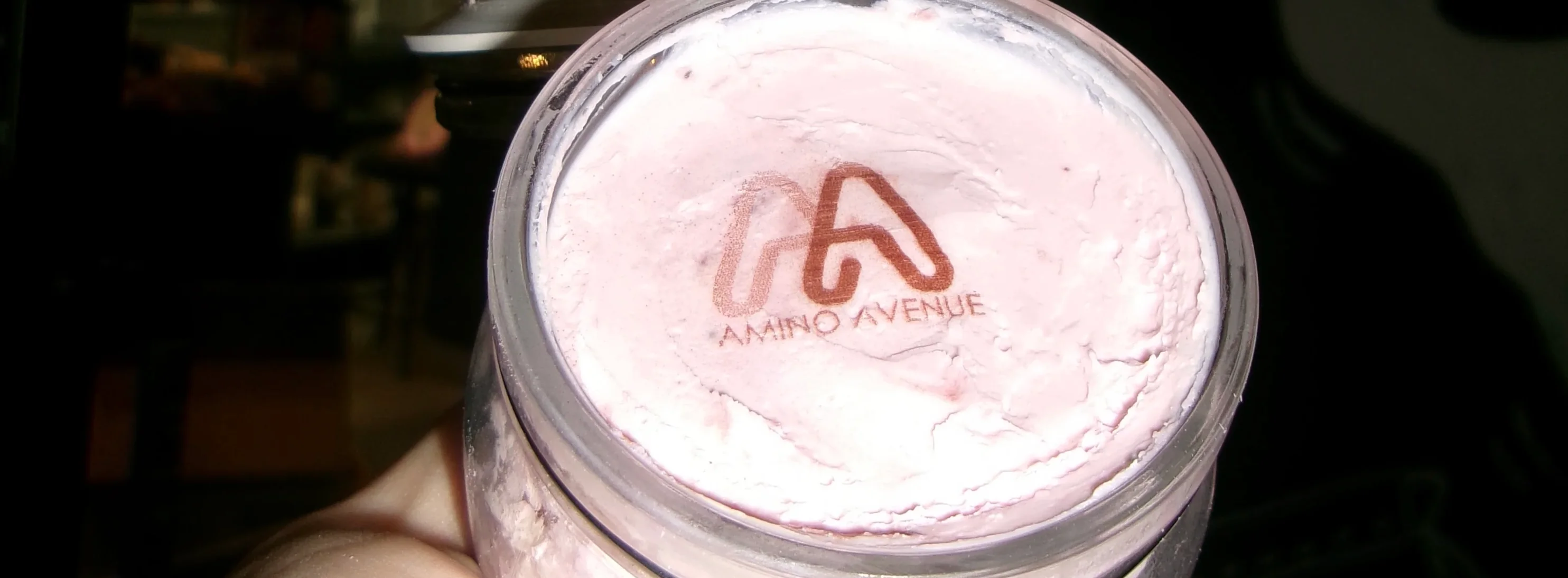 Creamy strawberry ice cream in a jar