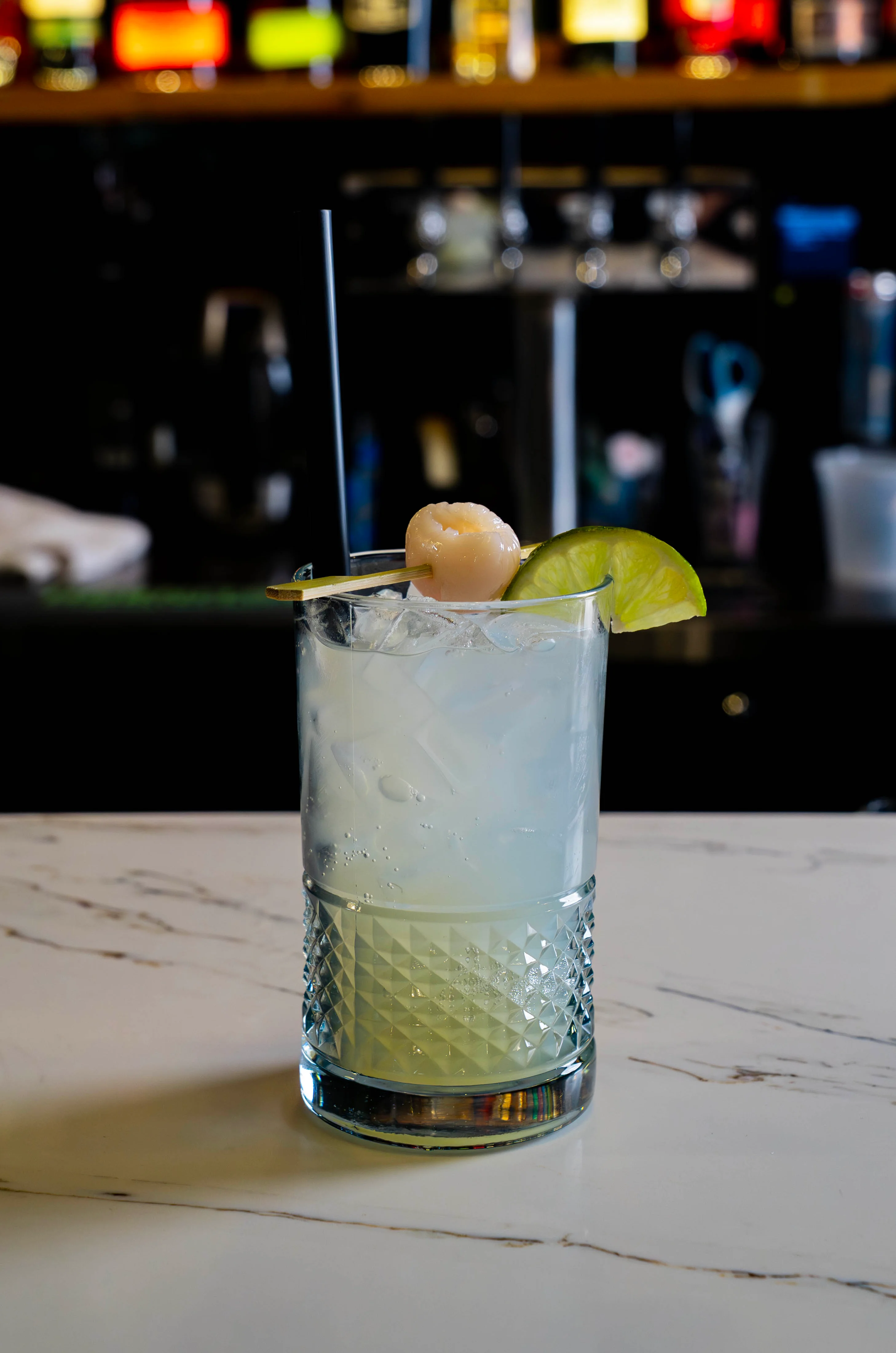 Refreshing Lychee Bursting Boba Ginger Spritzer mocktail in a glass