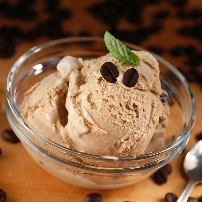 Creamy coffee ice cream in a glass bowl