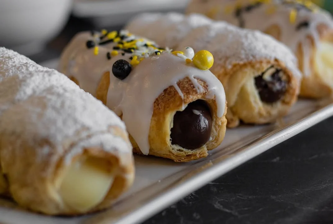 Italian cannoli with sweet cream filling and colorful toppings