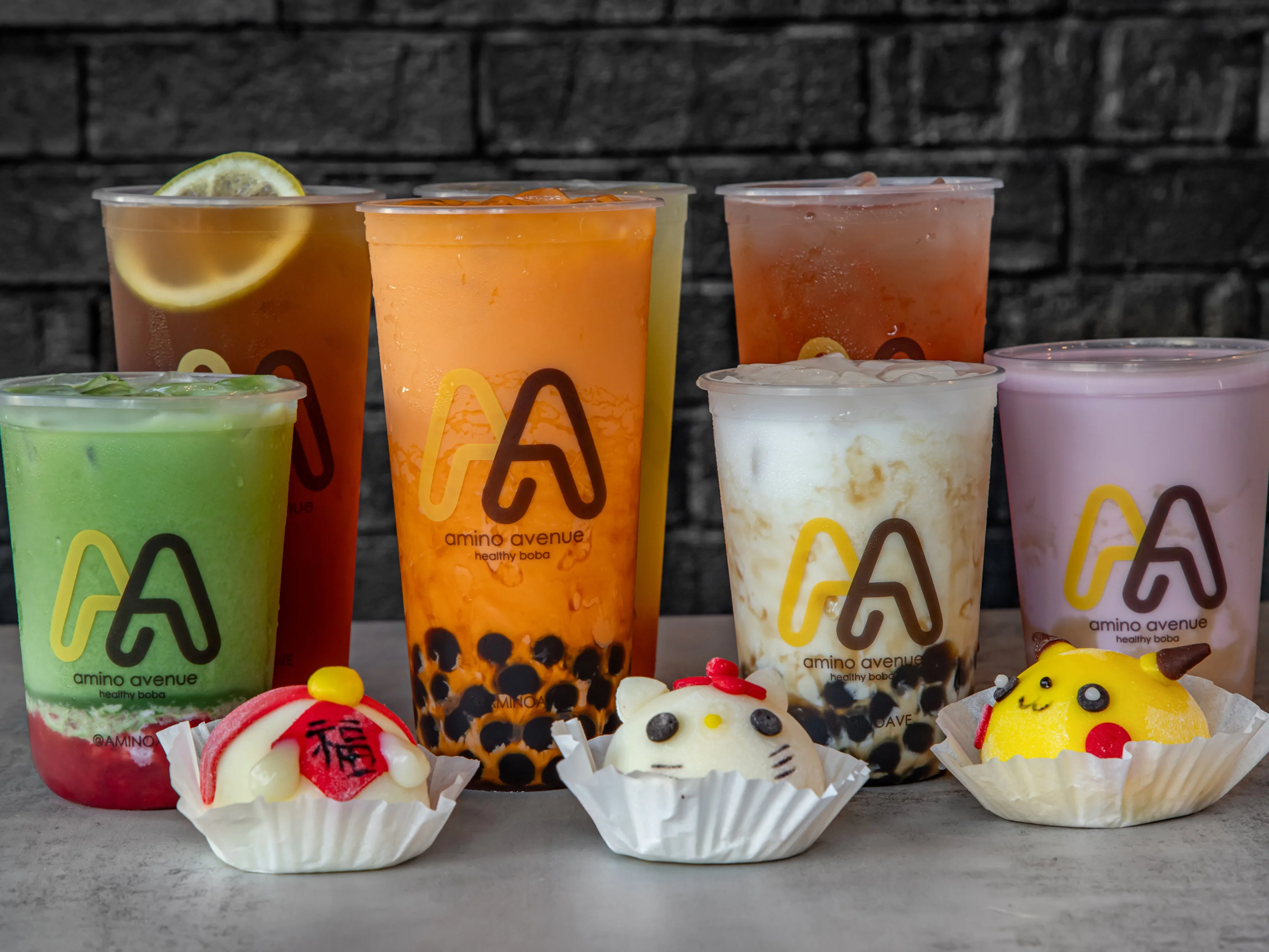 A vibrant boba tea shop interior with colorful drinks and seating.