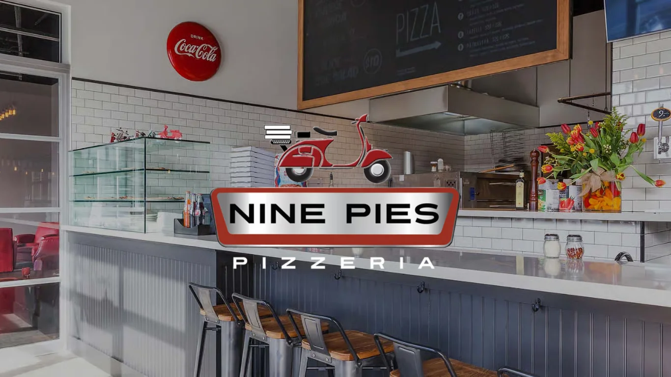 Modern pizzeria interior with vibrant decor and open kitchen