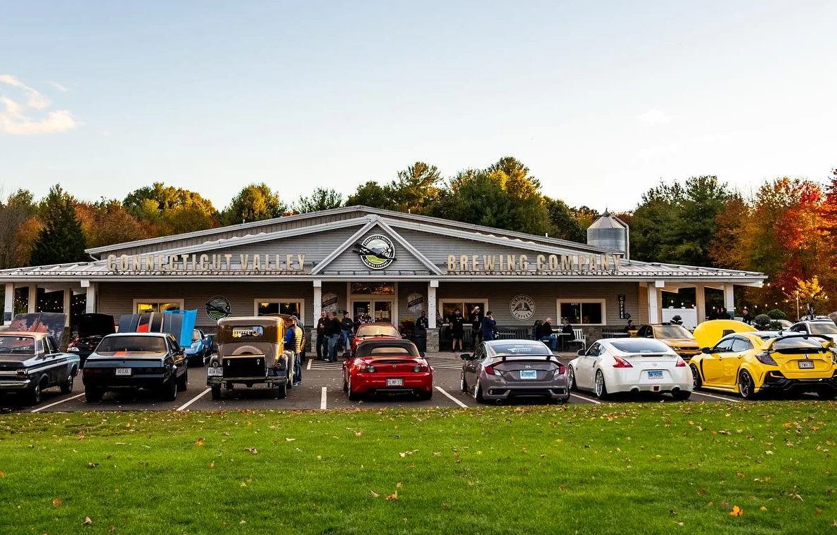 Connecticut Valley Brewing Company exterior with cars and autumn foliage