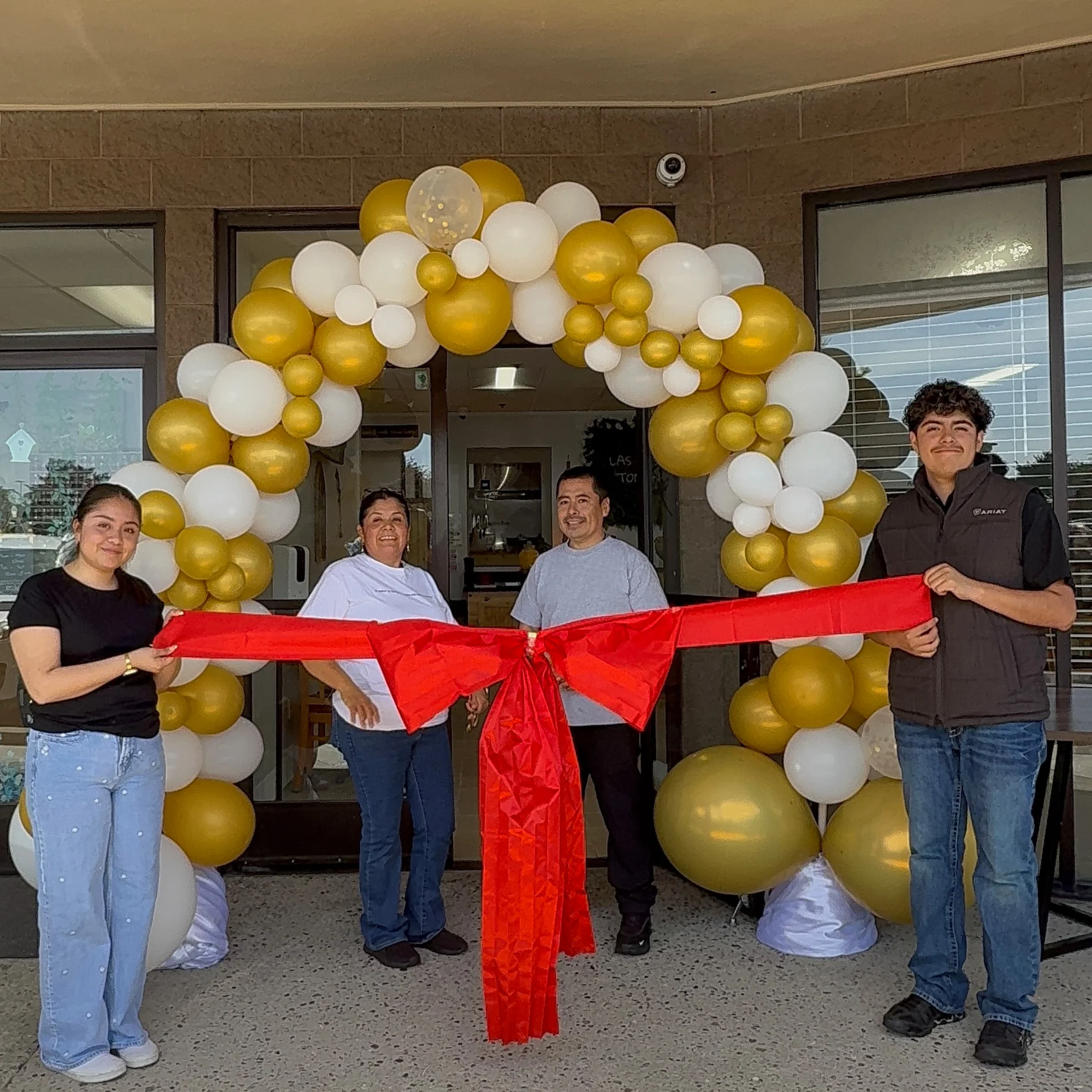 Grand opening celebration with a red ribbon cutting ceremony