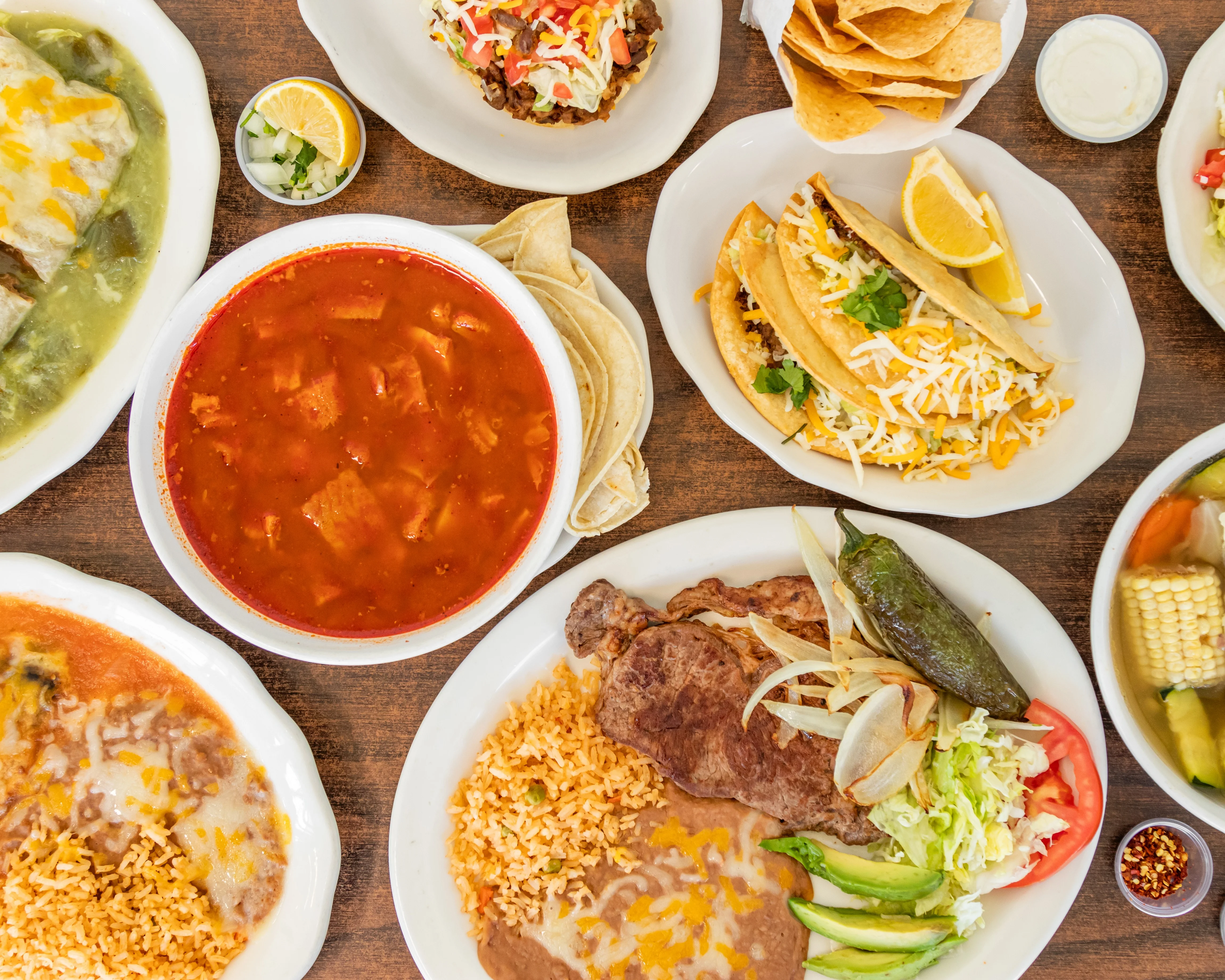 Authentic Mexican feast with tacos, enchiladas, and soup