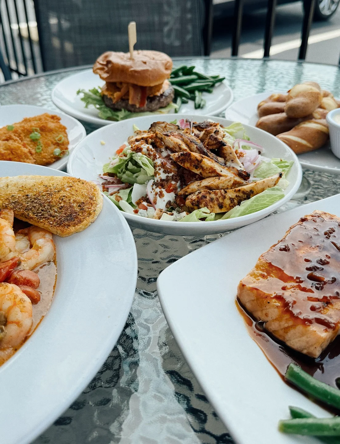 Southern shrimp and grits with grilled chicken salad and burger