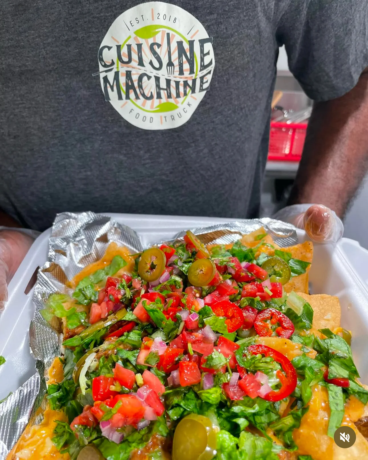Loaded nachos topped with fresh salsa and jalapeños