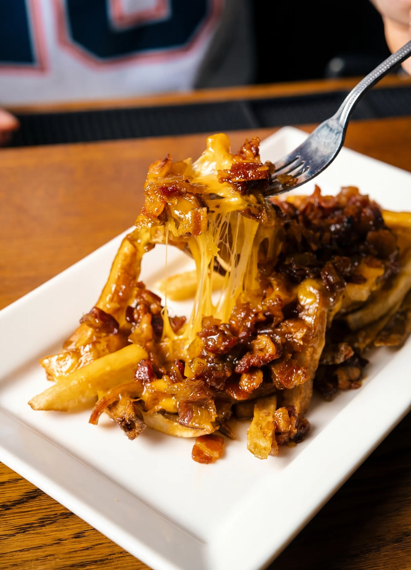 Loaded cheese fries with bacon and caramelized onions