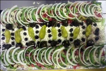 Colorful Mediterranean salad platter with olives and peppers