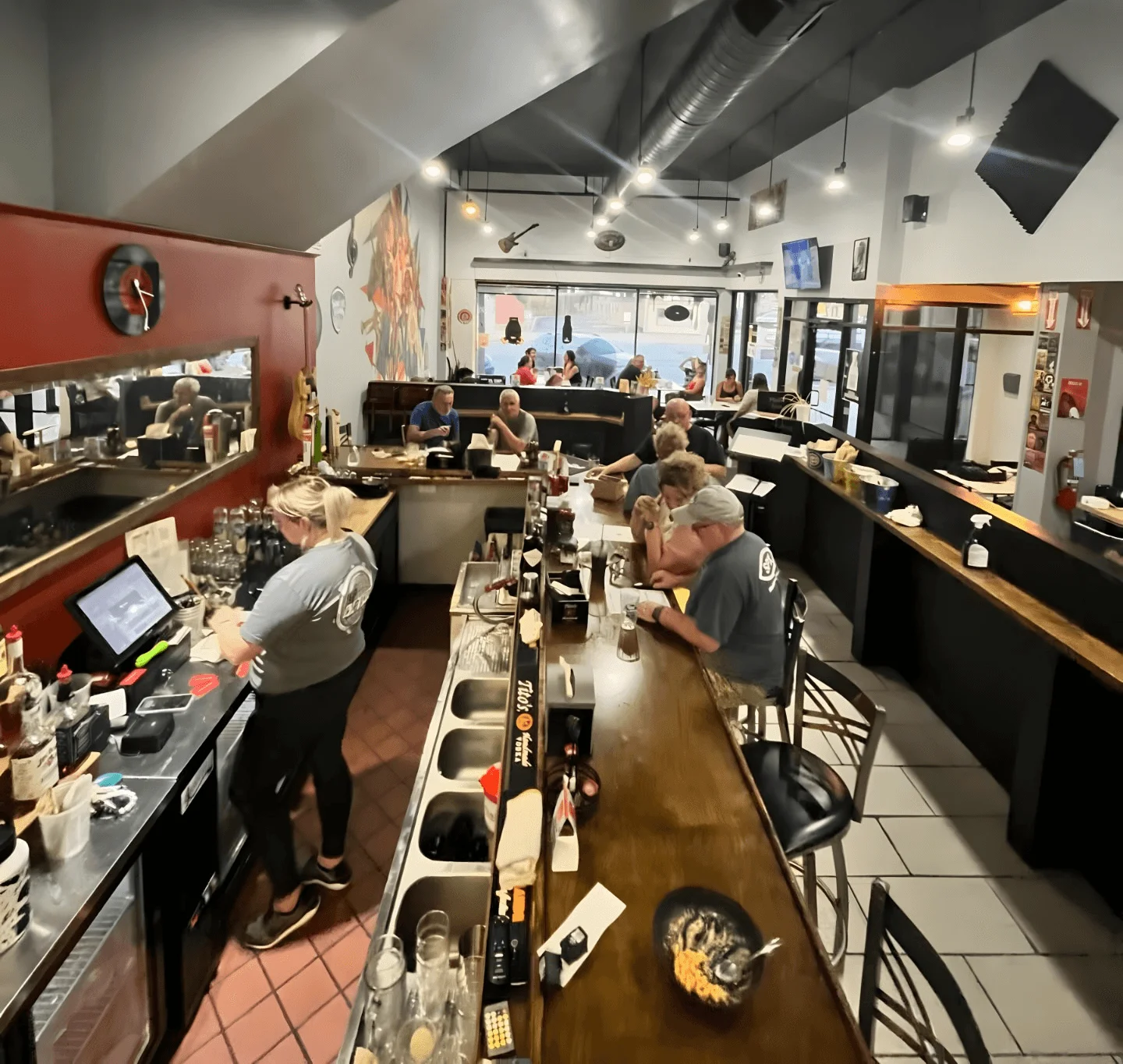 Cozy restaurant interior with patrons enjoying meals and drinks