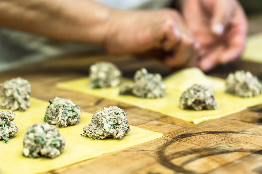 Preparing Italian ravioli with savory filling