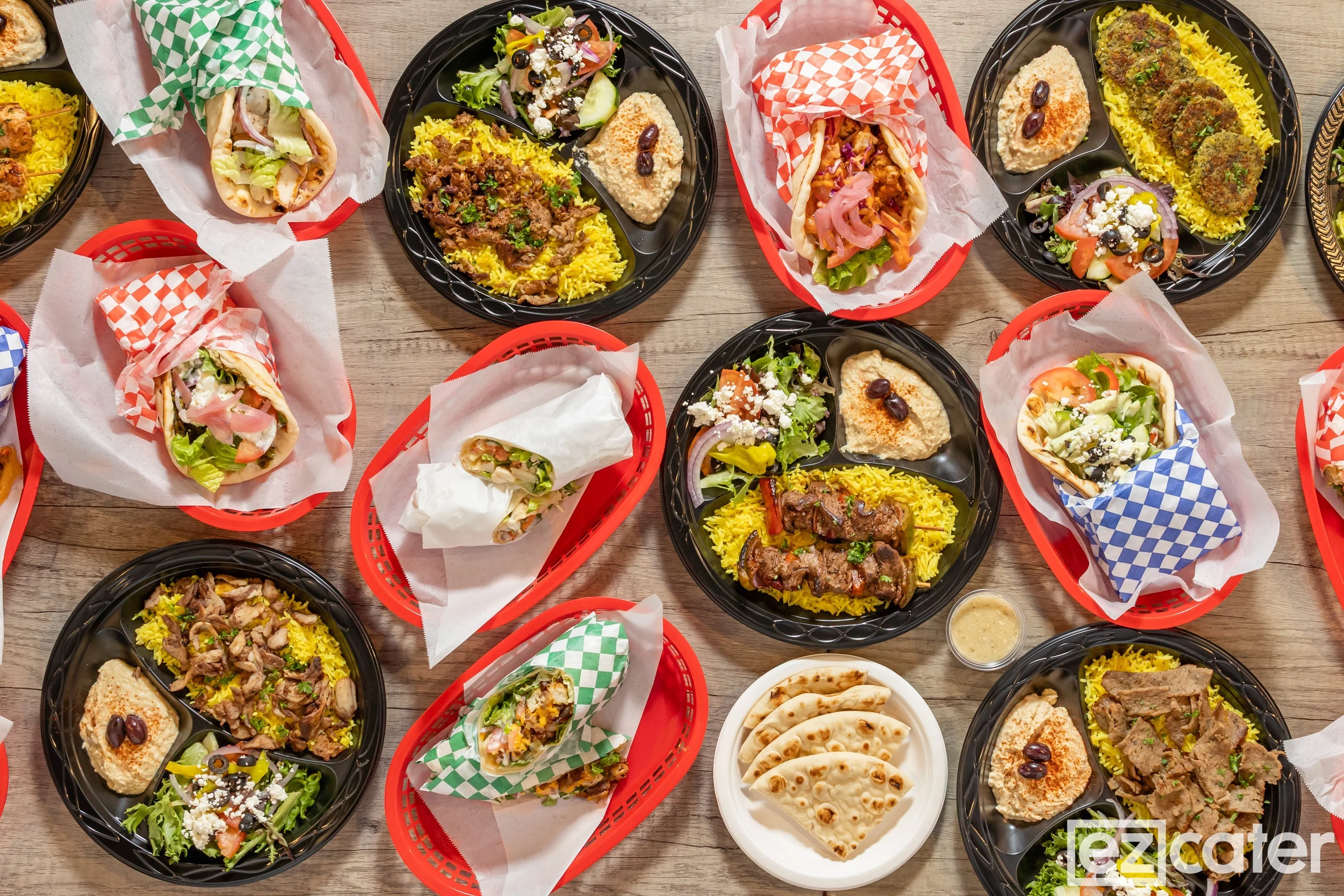 Assorted Mediterranean platters with kebabs, falafel, and fresh salads