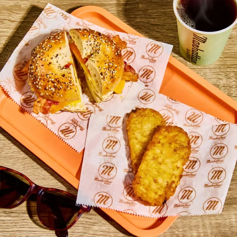 Delicious gourmet burger with fresh toppings on a wooden table