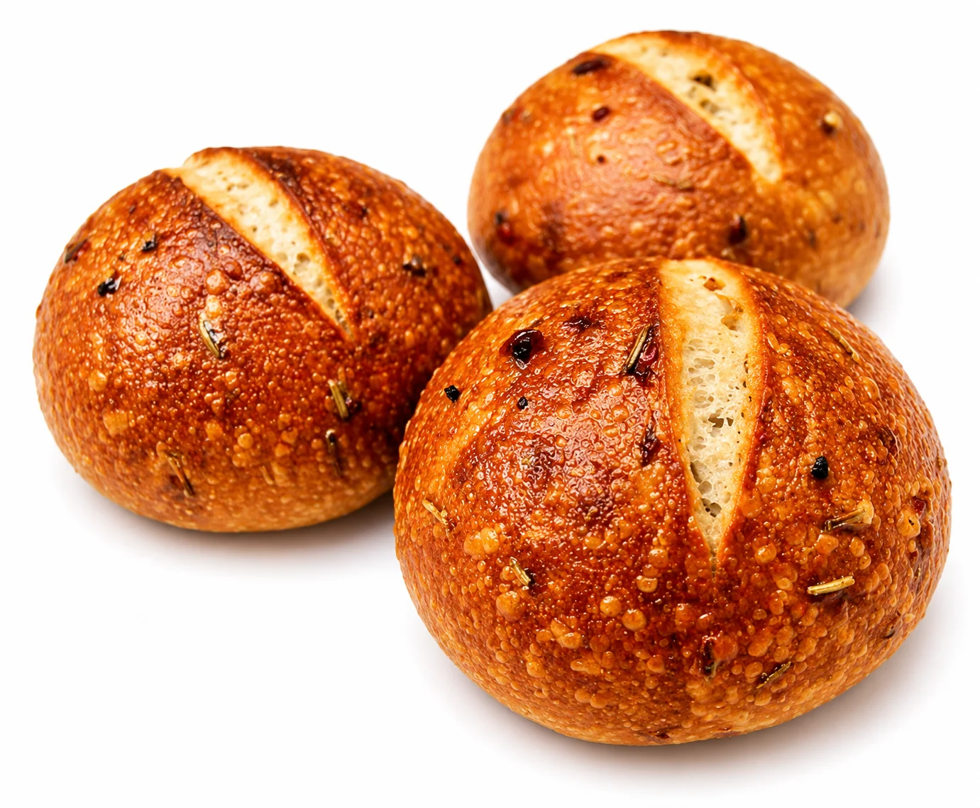 Three freshly baked round bread rolls with a golden crust.