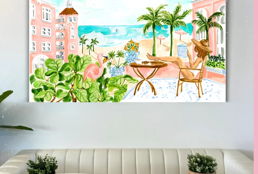 Tropical beach view with pink buildings and outdoor seating