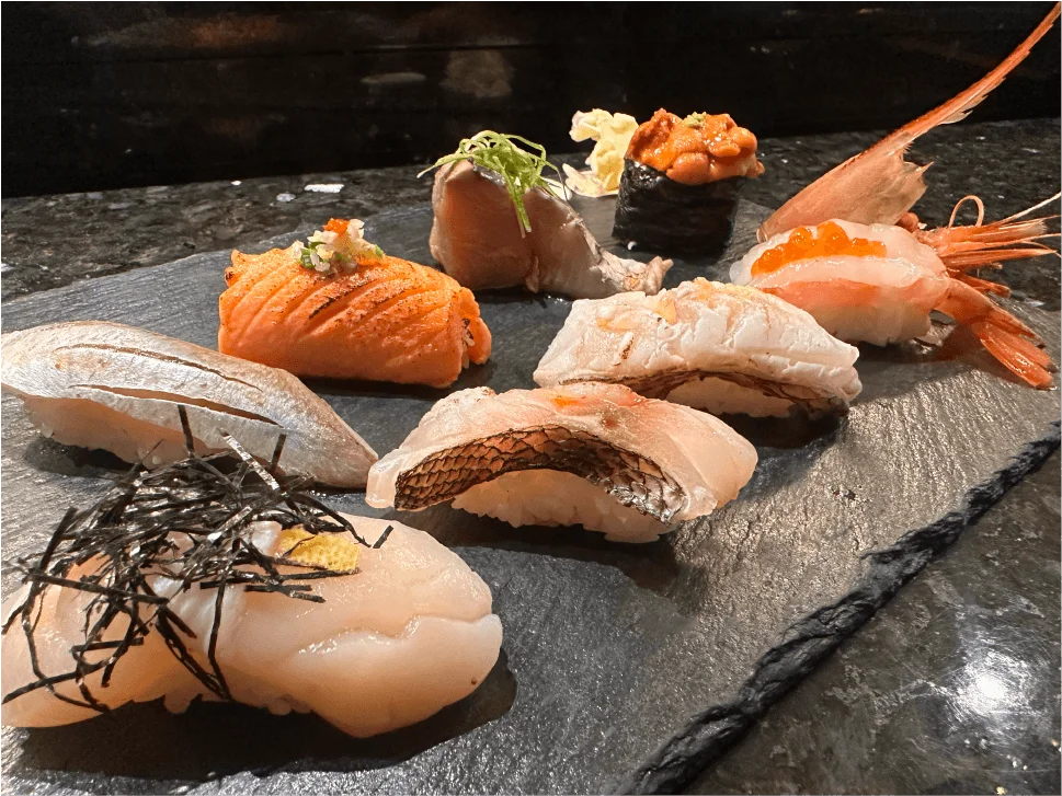 Nigiri sushi selection on slate — scallop, snapper, salmon, uni and sweet shrimp — at Mahzu East Windsor