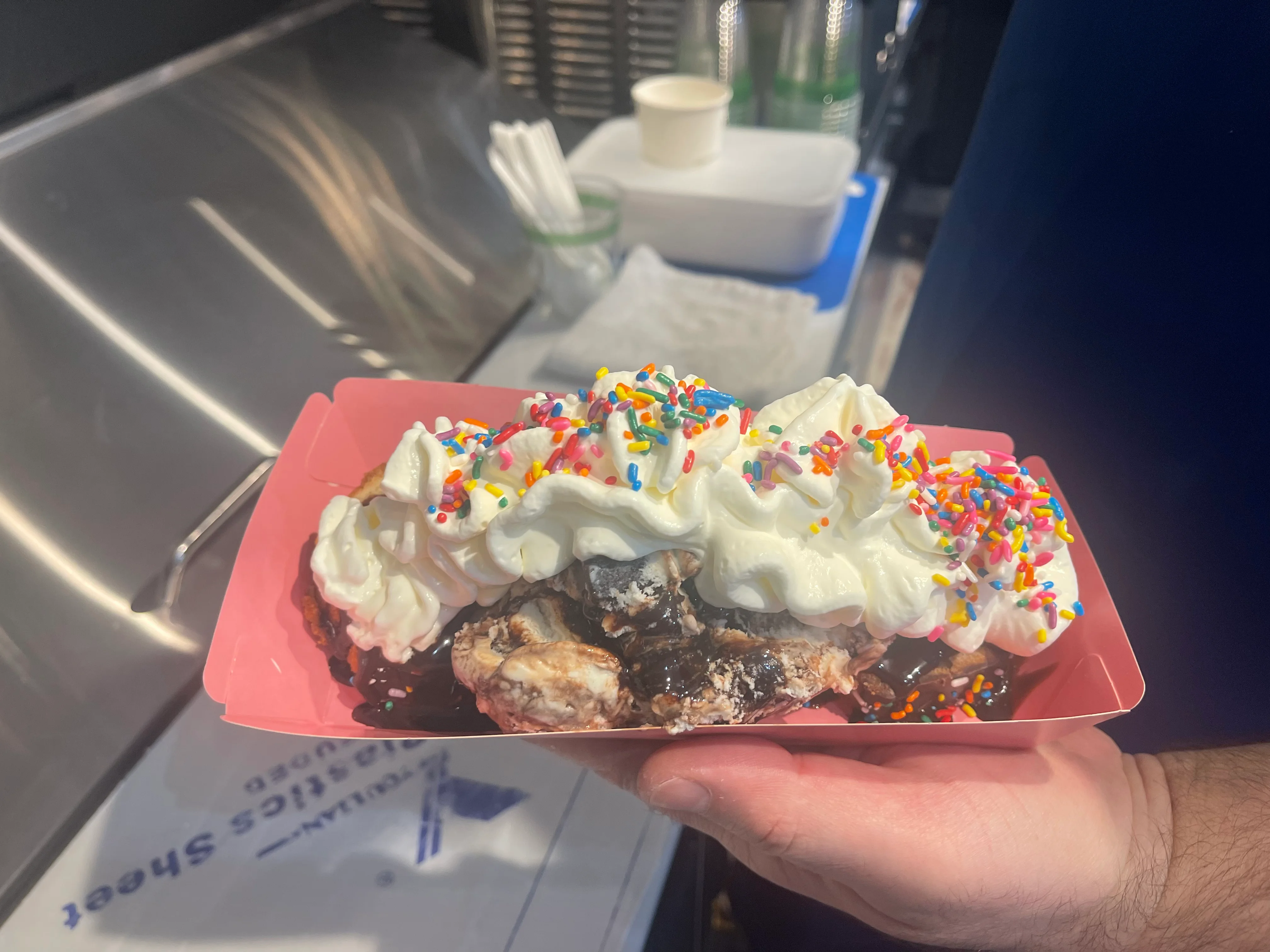 Decadent ice cream sundae with whipped cream and sprinkles