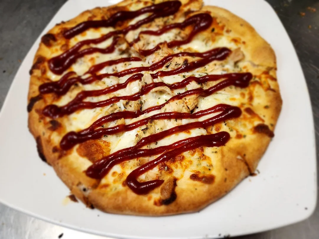 BBQ chicken pizza with drizzled sauce