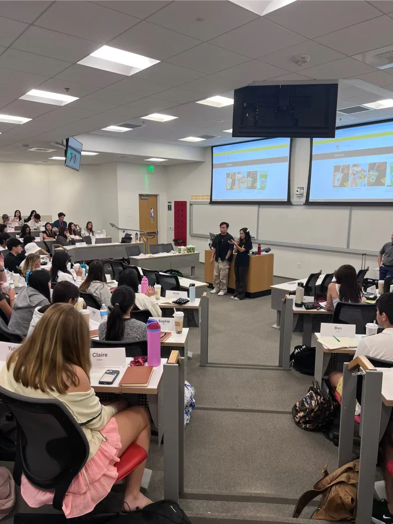Students attending a presentation in a classroom setting