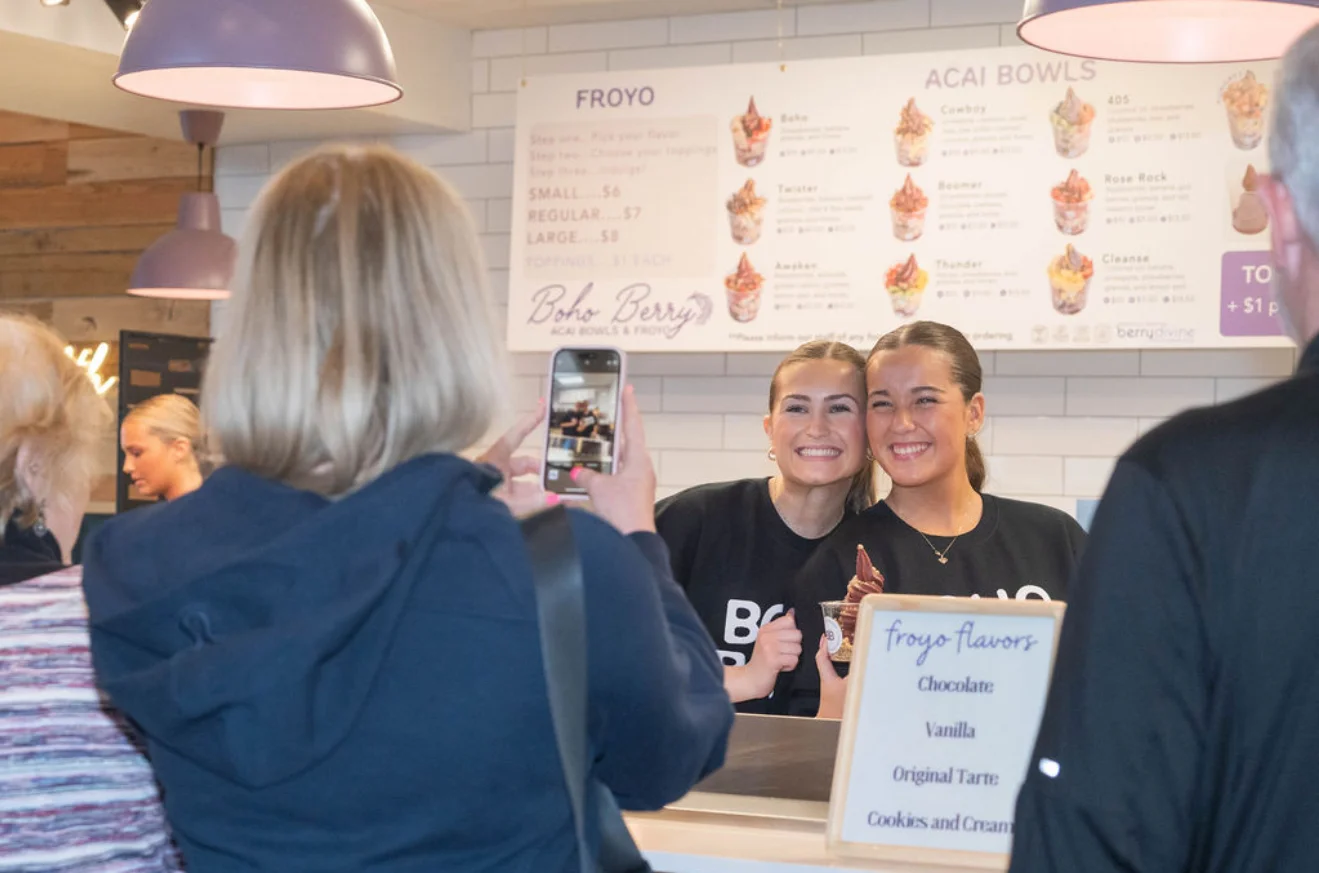 Friendly staff at Boho Berry serving acai bowls and froyo