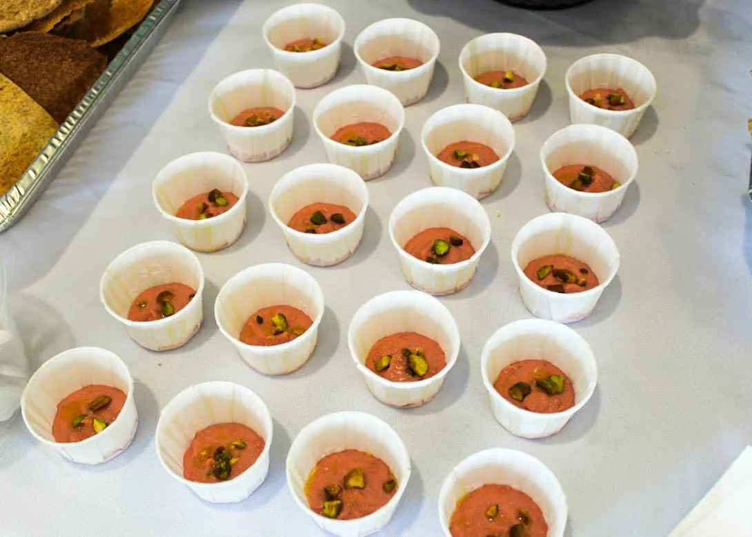 Traditional Indian dessert in small cups with pistachios