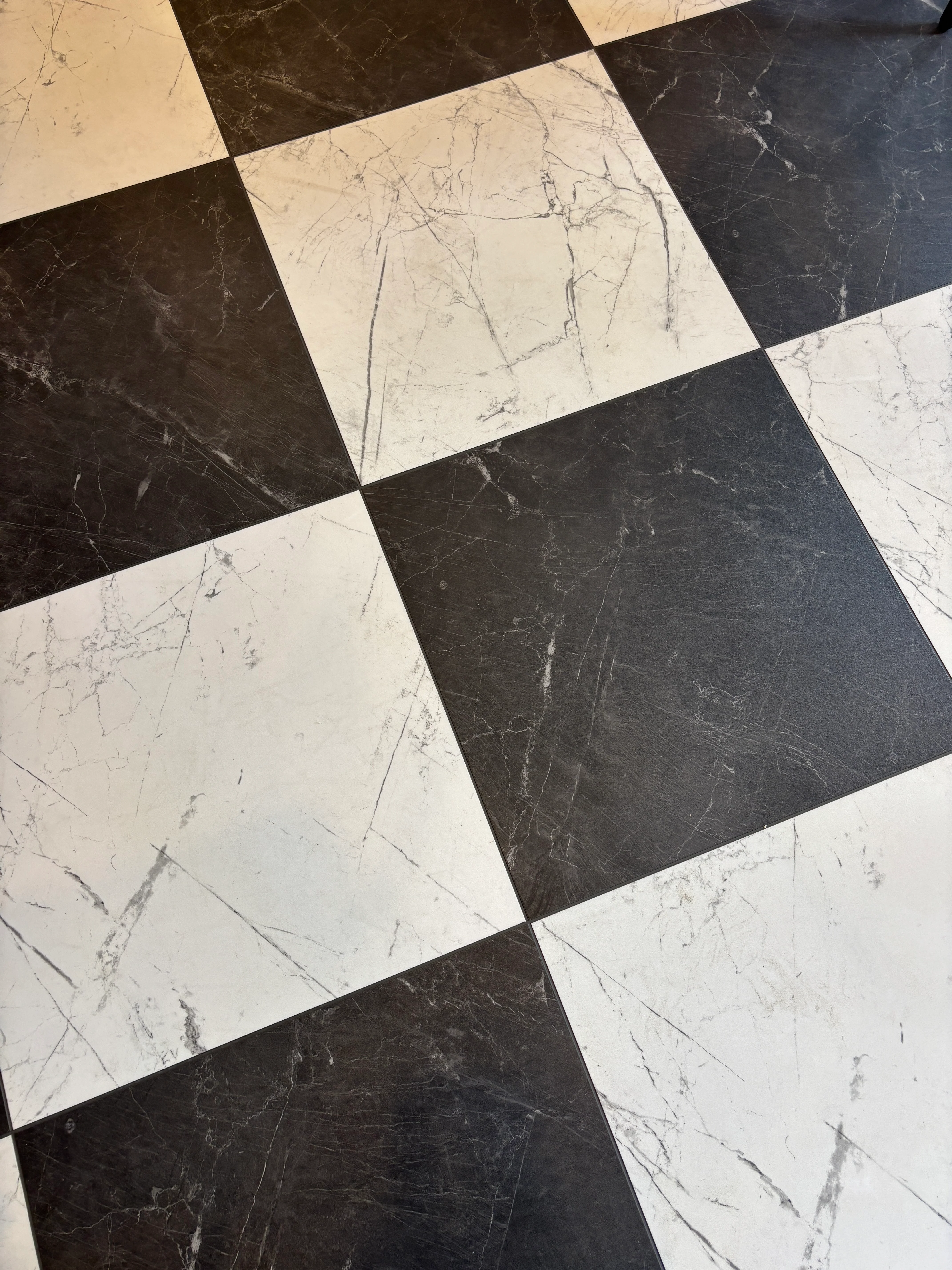 Stylish black and white checkered floor design in a restaurant