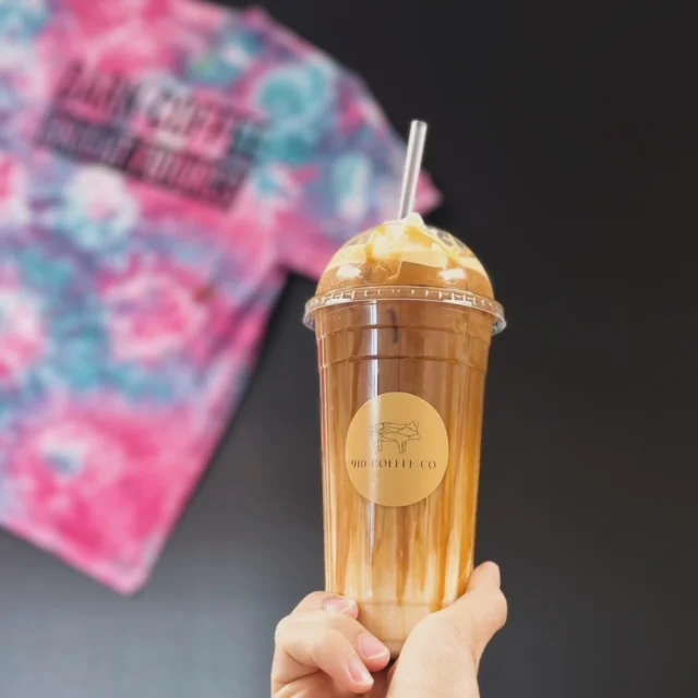 Iced coffee drink with caramel swirl in a clear cup