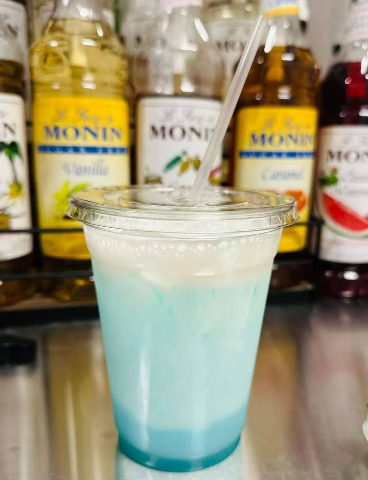 Colorful layered drink with blue and white hues