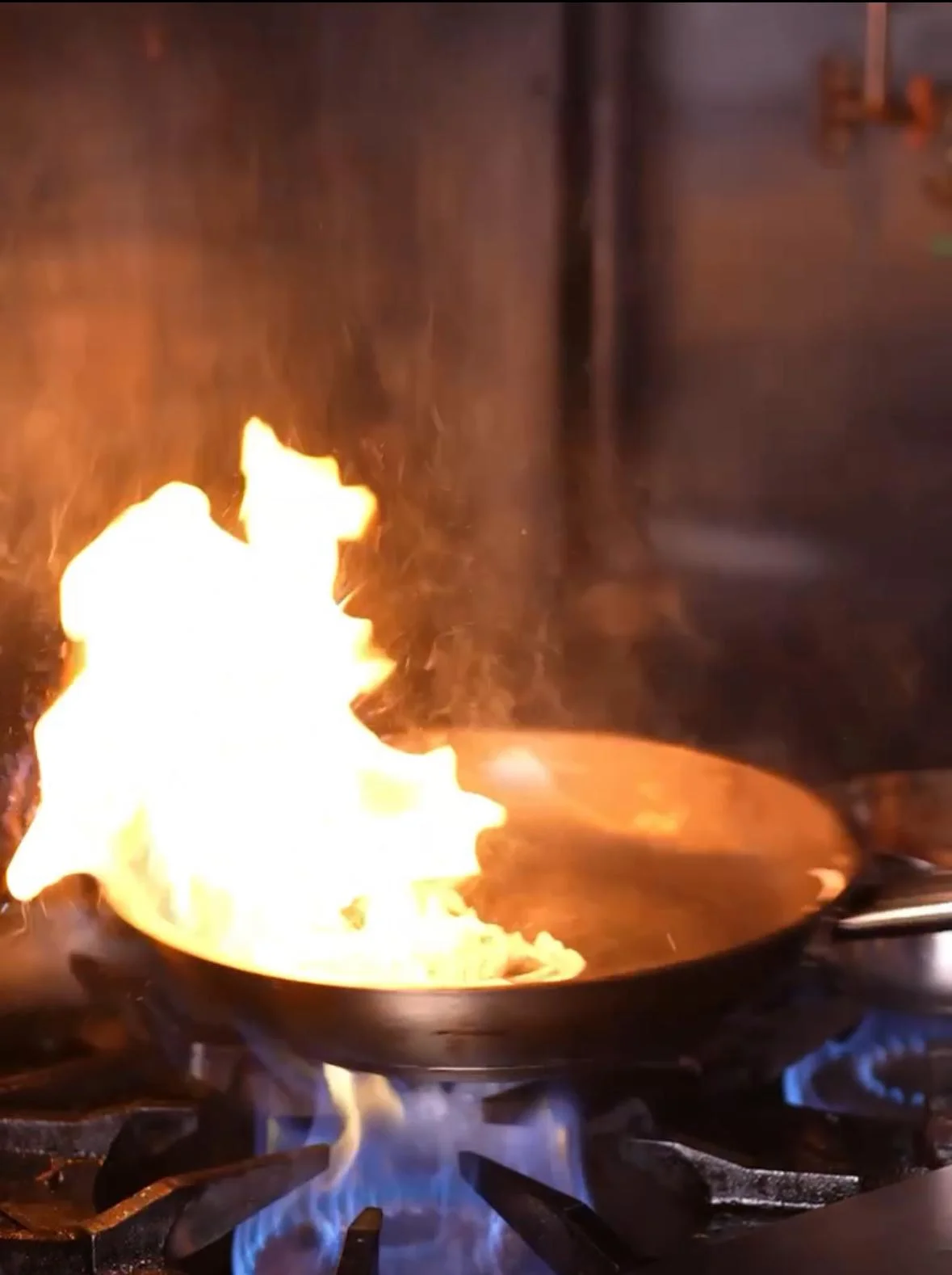 Flambé cooking technique in a professional kitchen