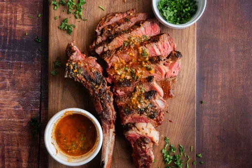 Grilled tomahawk steak with chimichurri sauce