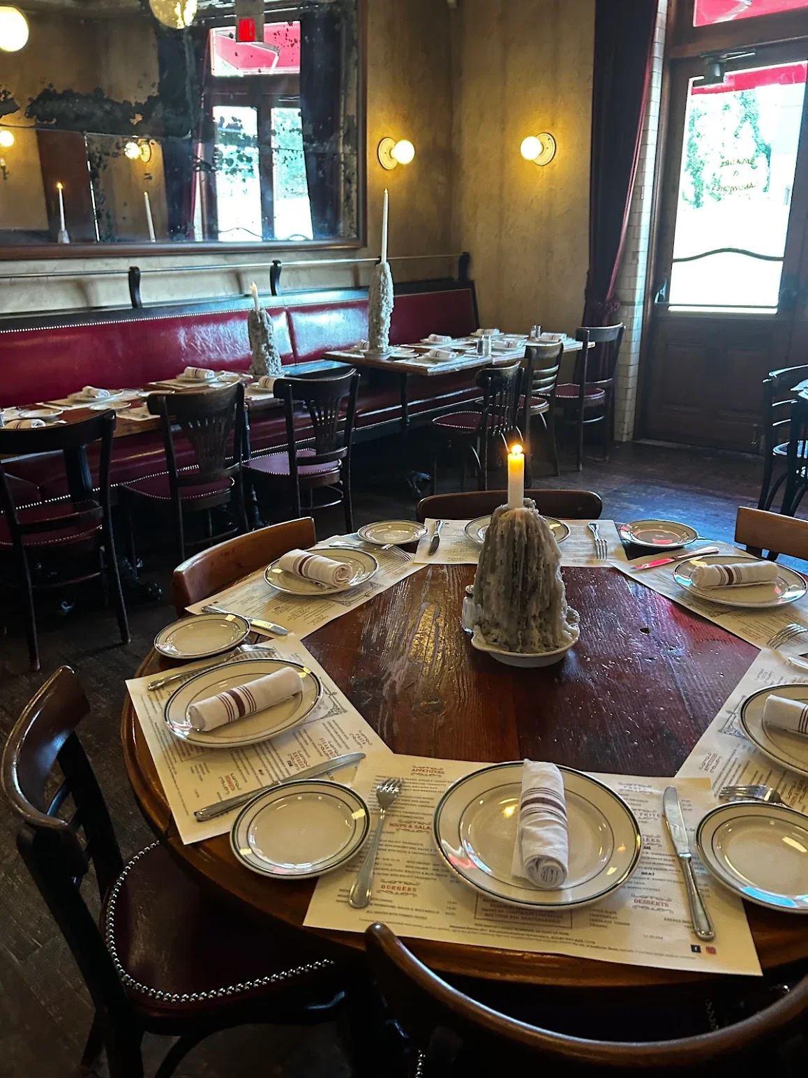 Elegant restaurant dining setup with candlelight and polished tableware