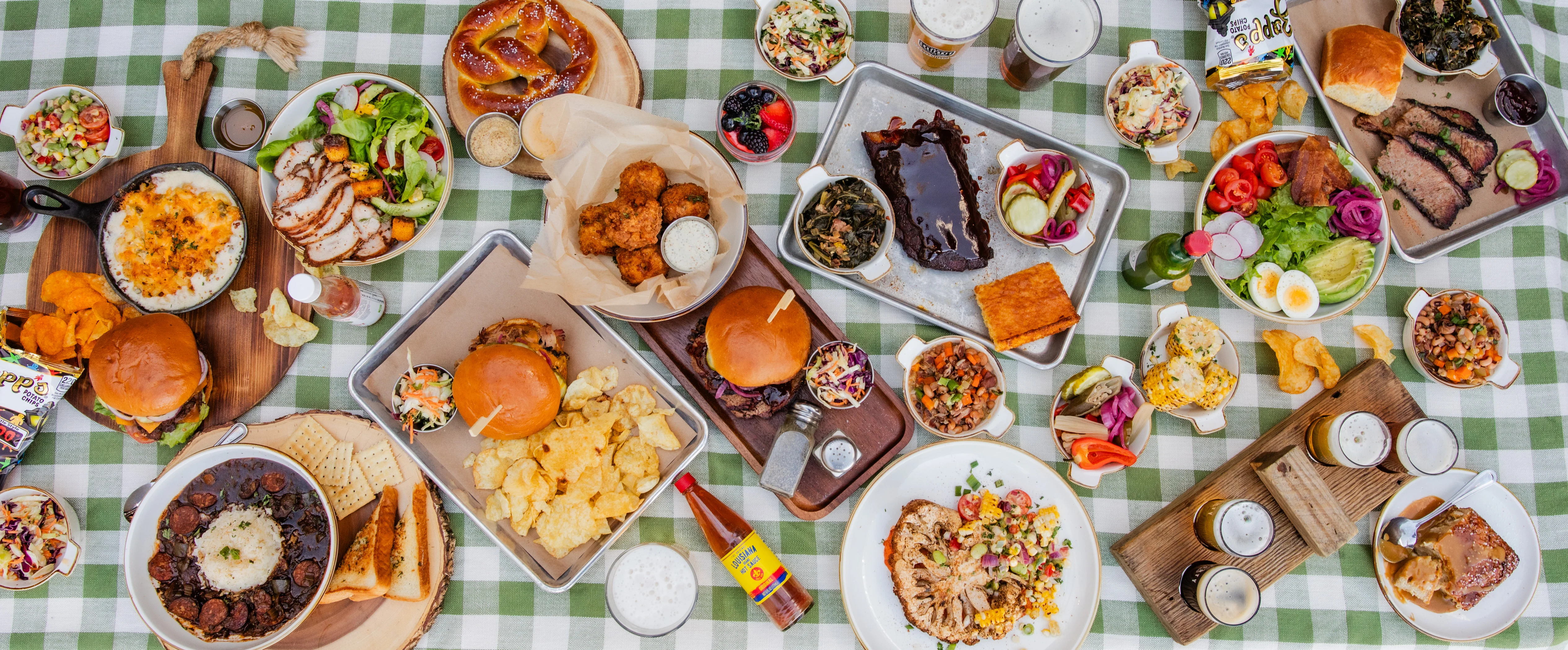 Assorted Southern barbecue dishes on a picnic table