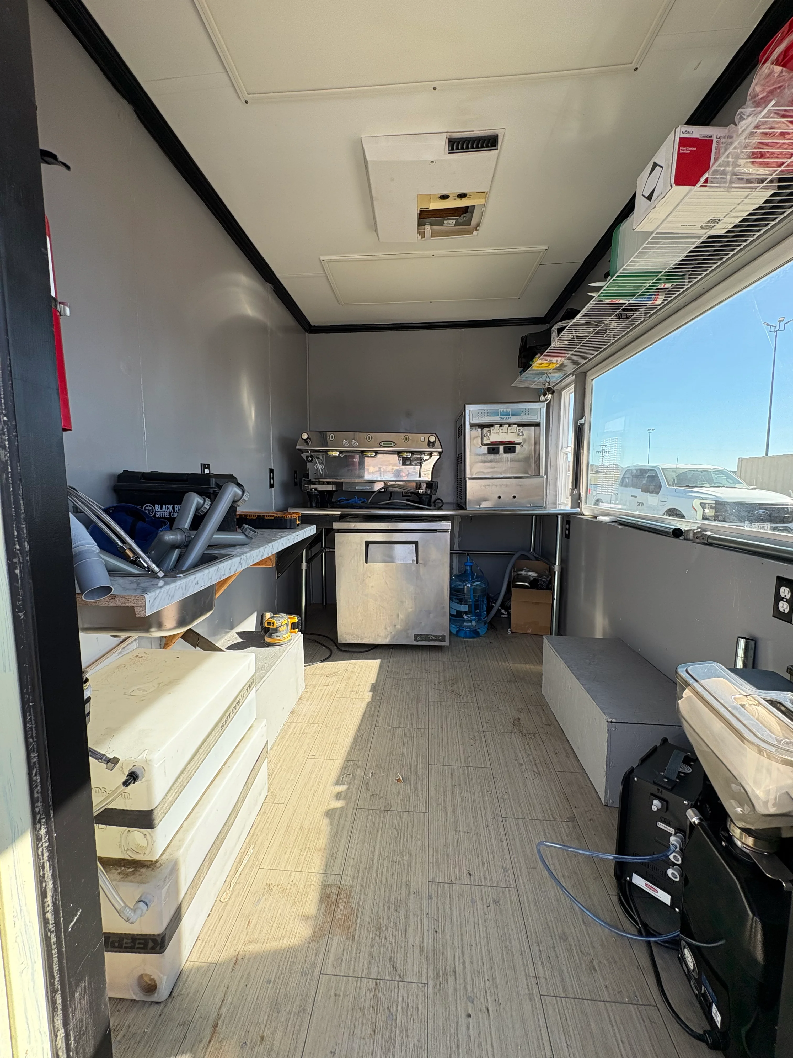 Interior of a food truck kitchen with equipment and workspace
