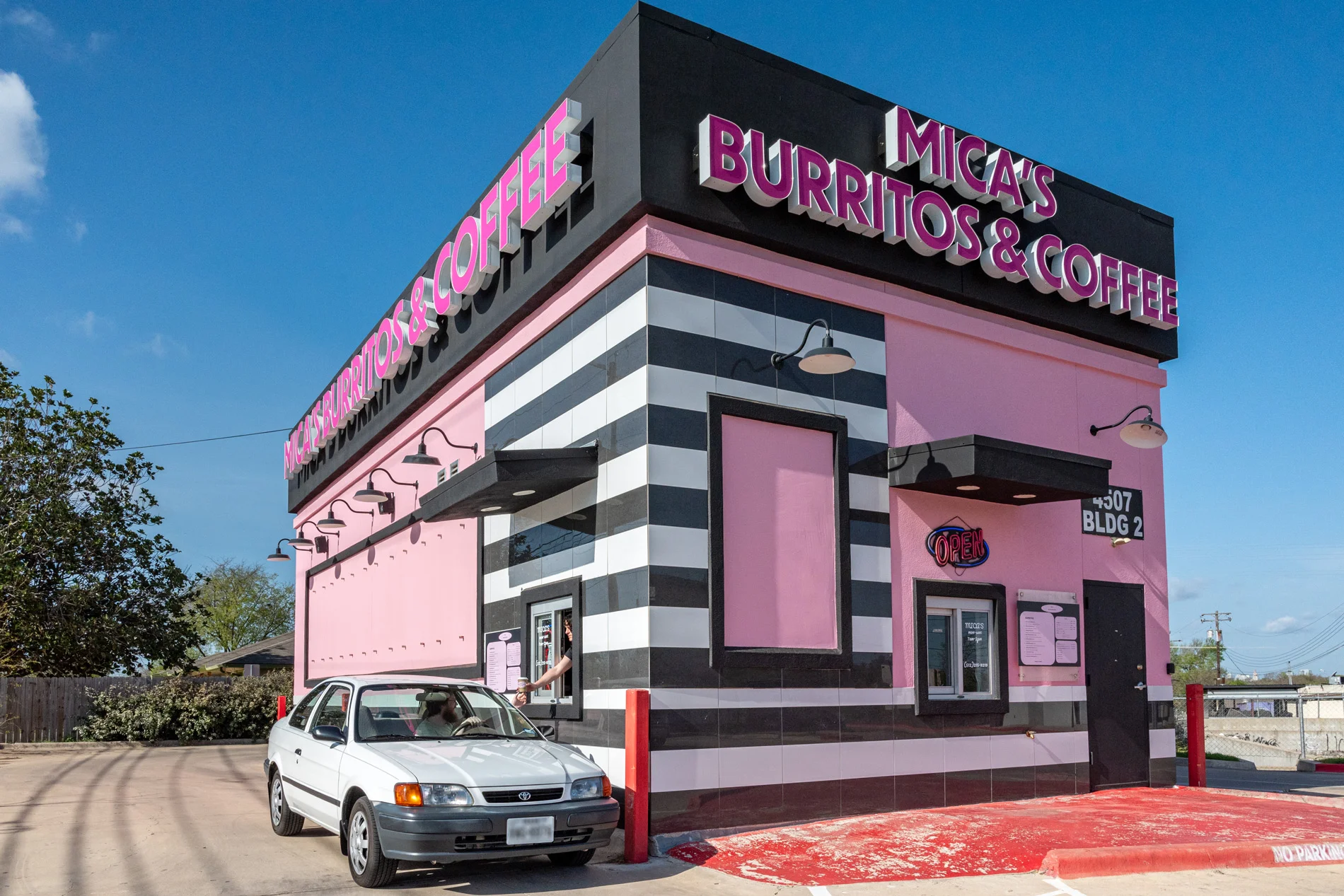 Colorful burrito restaurant exterior with drive-thru