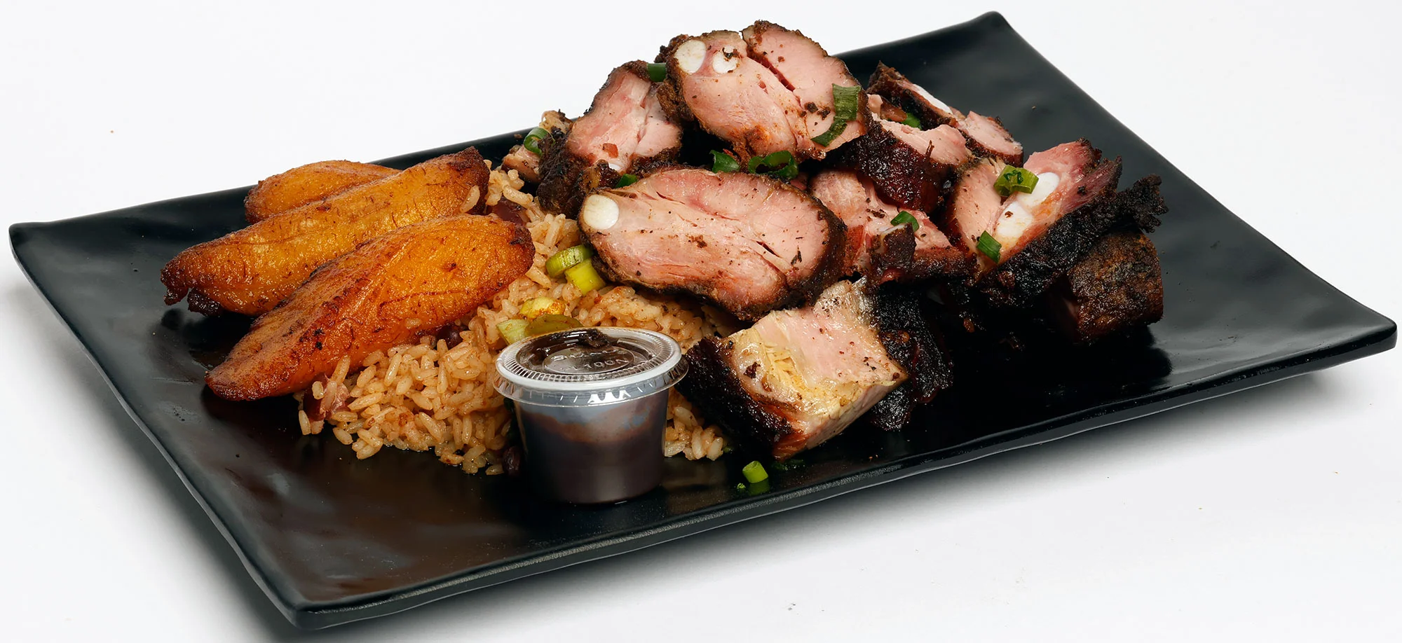 Jamaican jerk chicken with rice and fried plantains