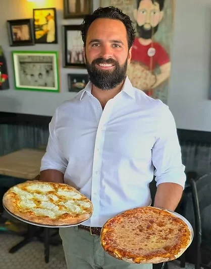 Pizzas served in a cozy restaurant setting