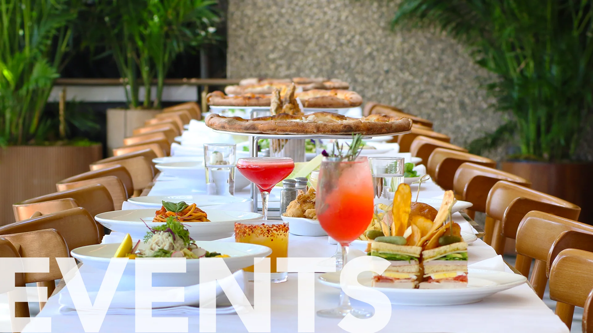 Elegant dining setup for events with gourmet dishes and cocktails