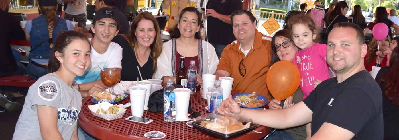 Group of friends enjoying a meal at a casual dining spot