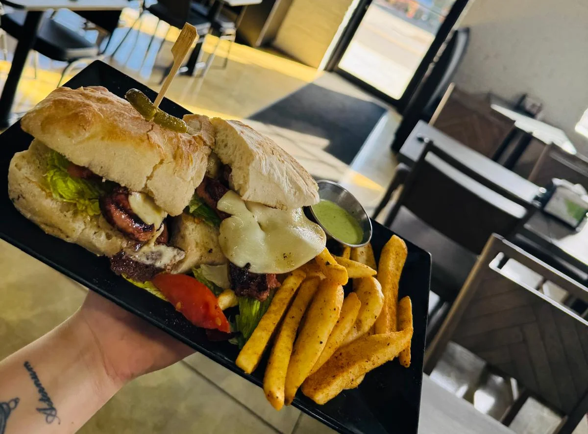Gourmet burger with fries in a modern restaurant setting