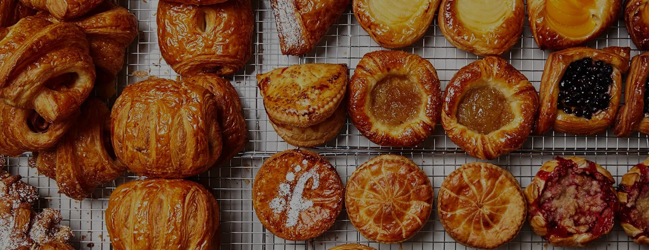 Assorted French pastries on a cooling rack