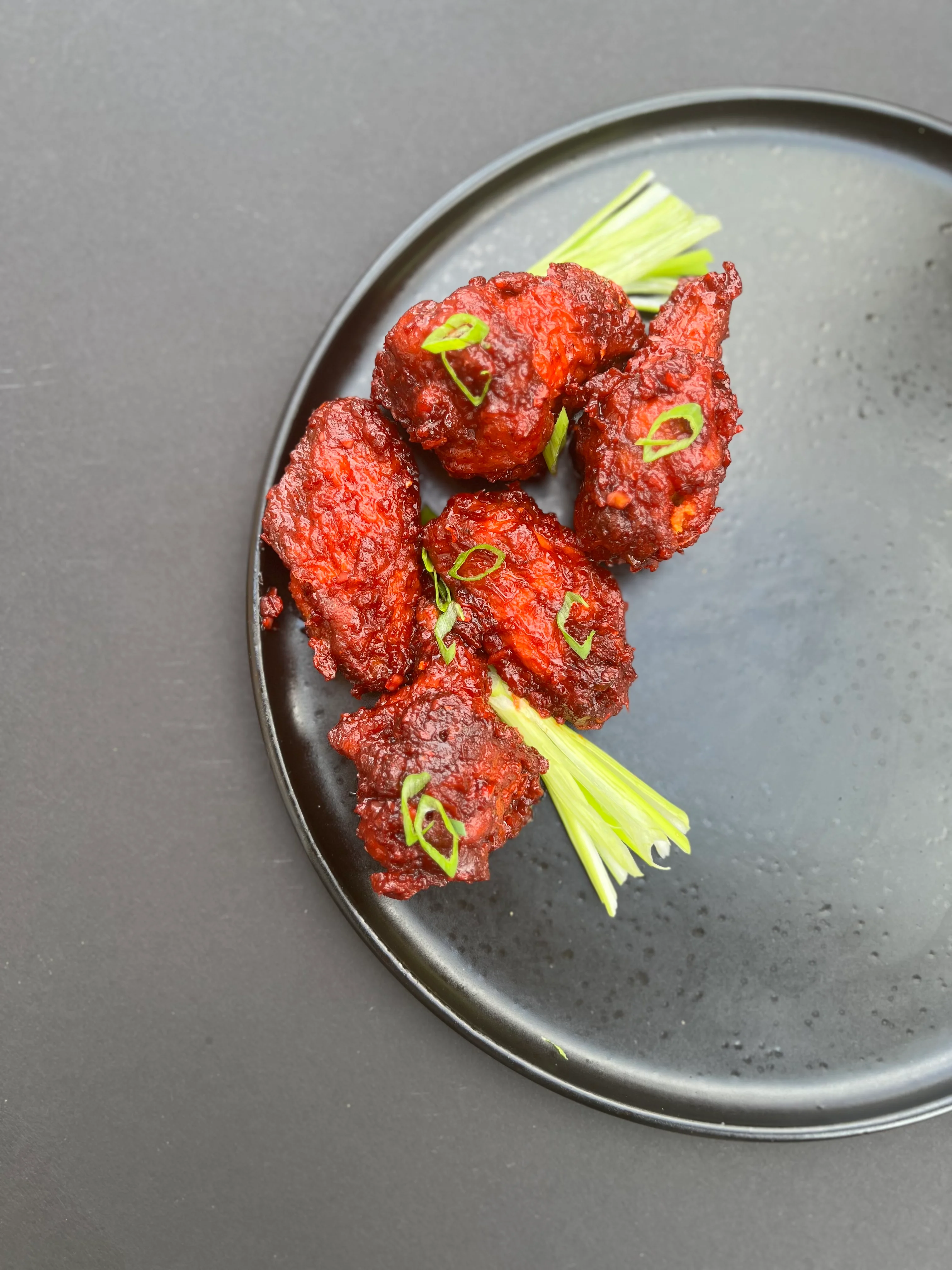 Crispy Korean fried chicken with scallions