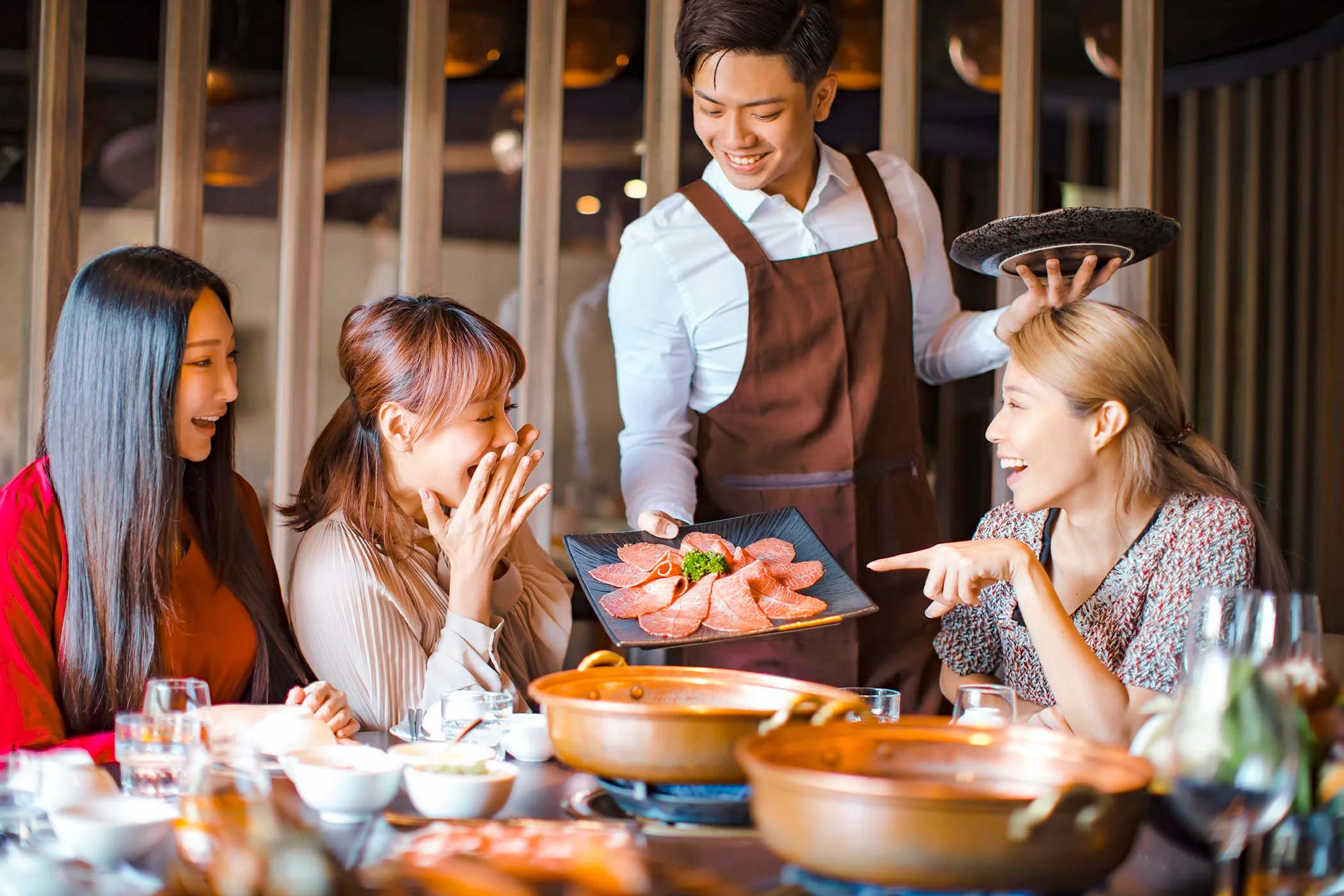 Japanese shabu-shabu served in a modern restaurant setting