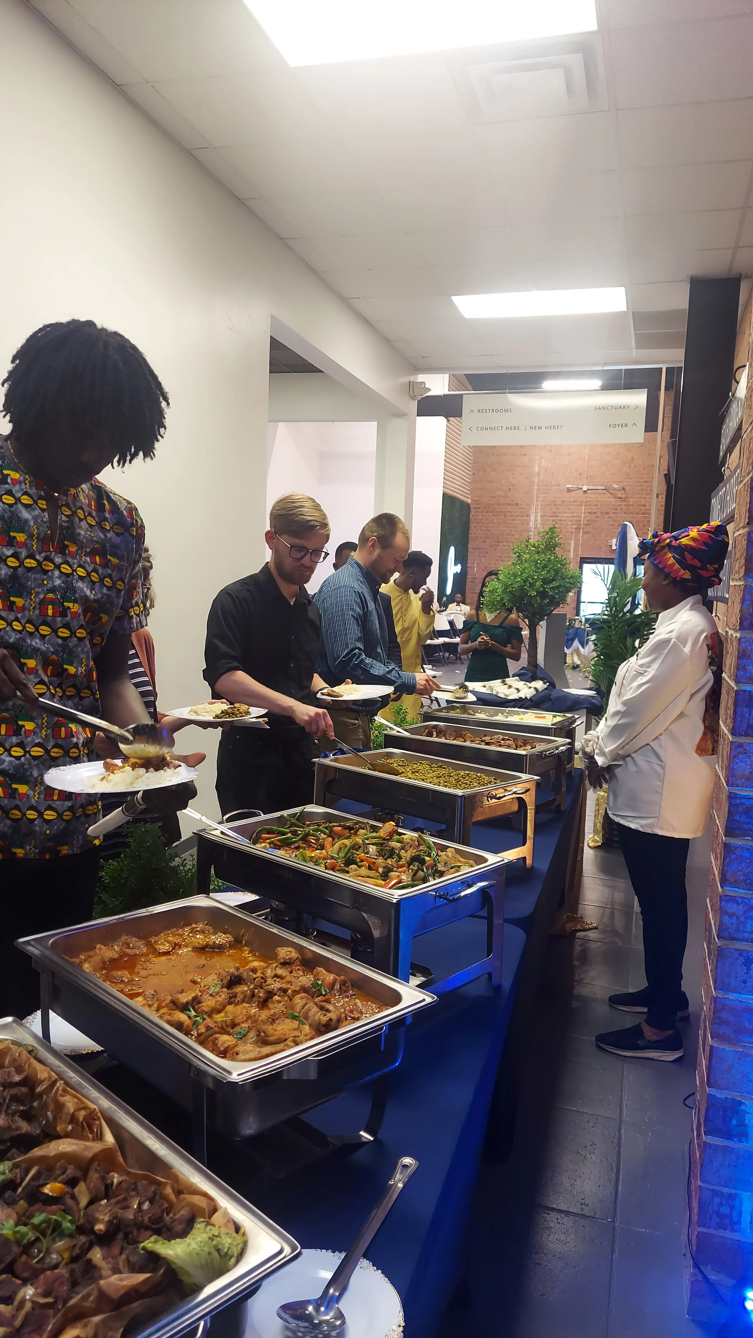 Buffet of West African jollof rice and assorted dishes