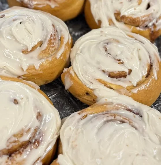 Freshly baked cinnamon rolls with cream cheese frosting