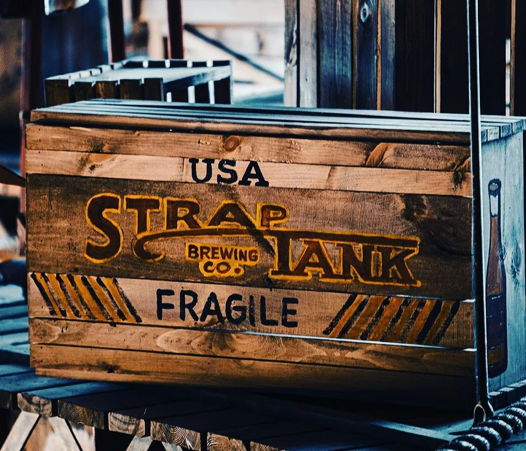 Vintage wooden crate from Strap Tank Brewing Co.