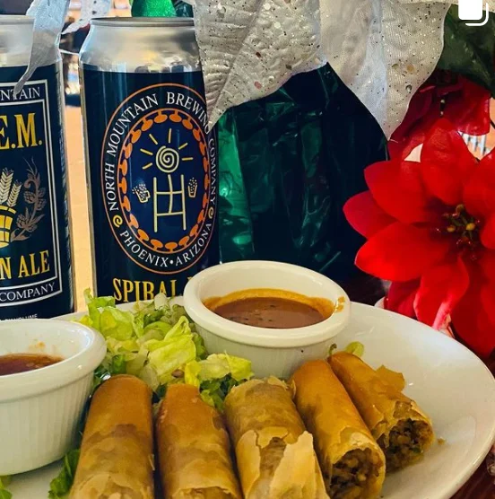 Crispy spring rolls with dipping sauces on a plate