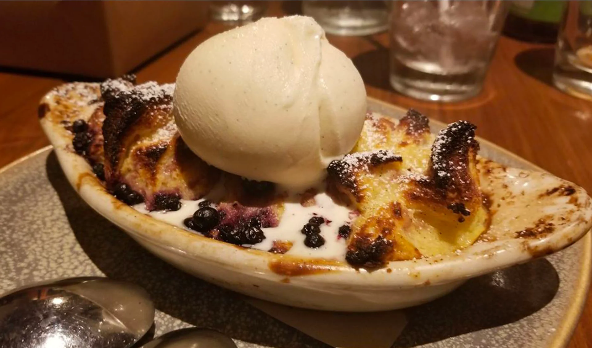bread pudding topped with fresh ice cream