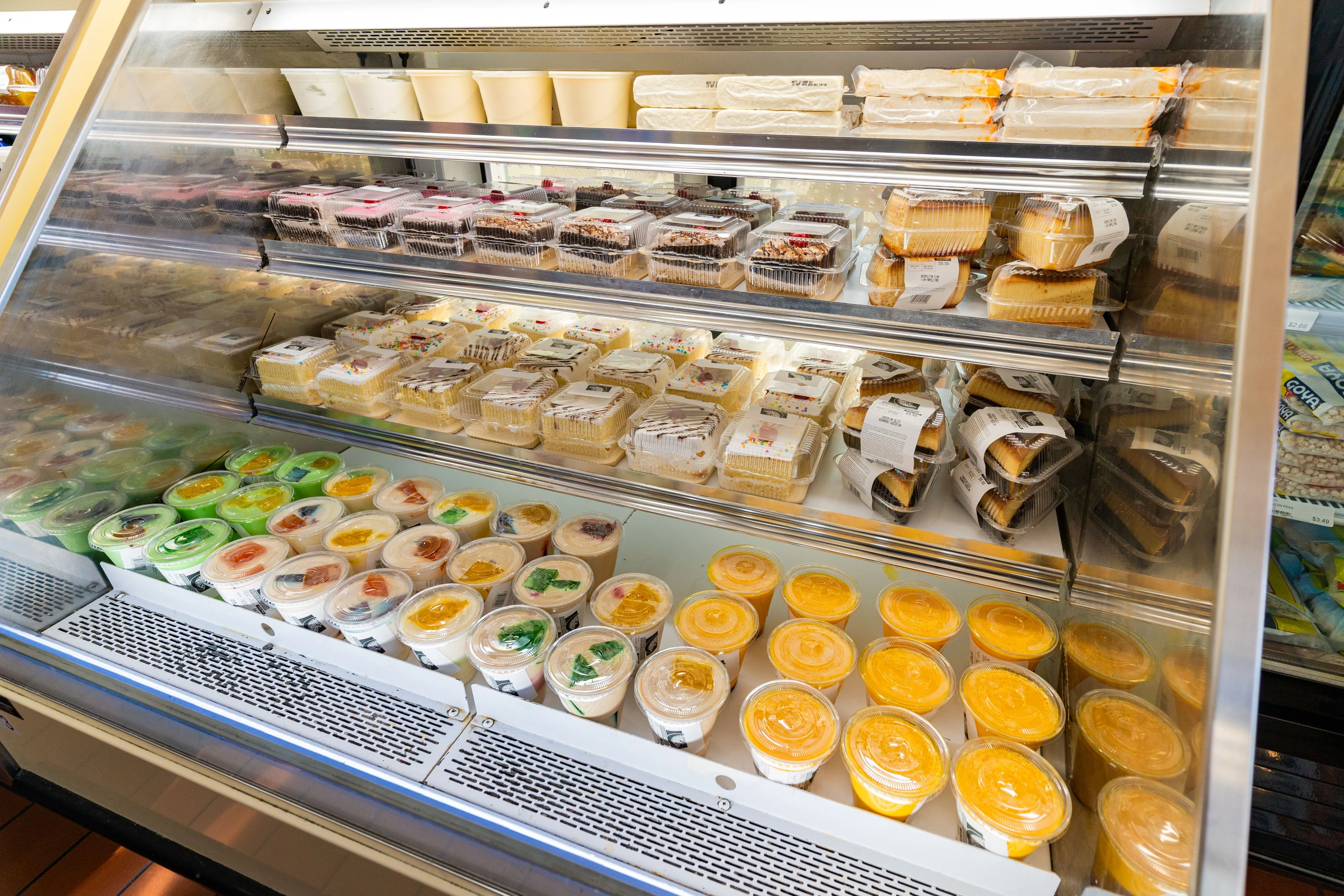 Assorted desserts in a refrigerated display case