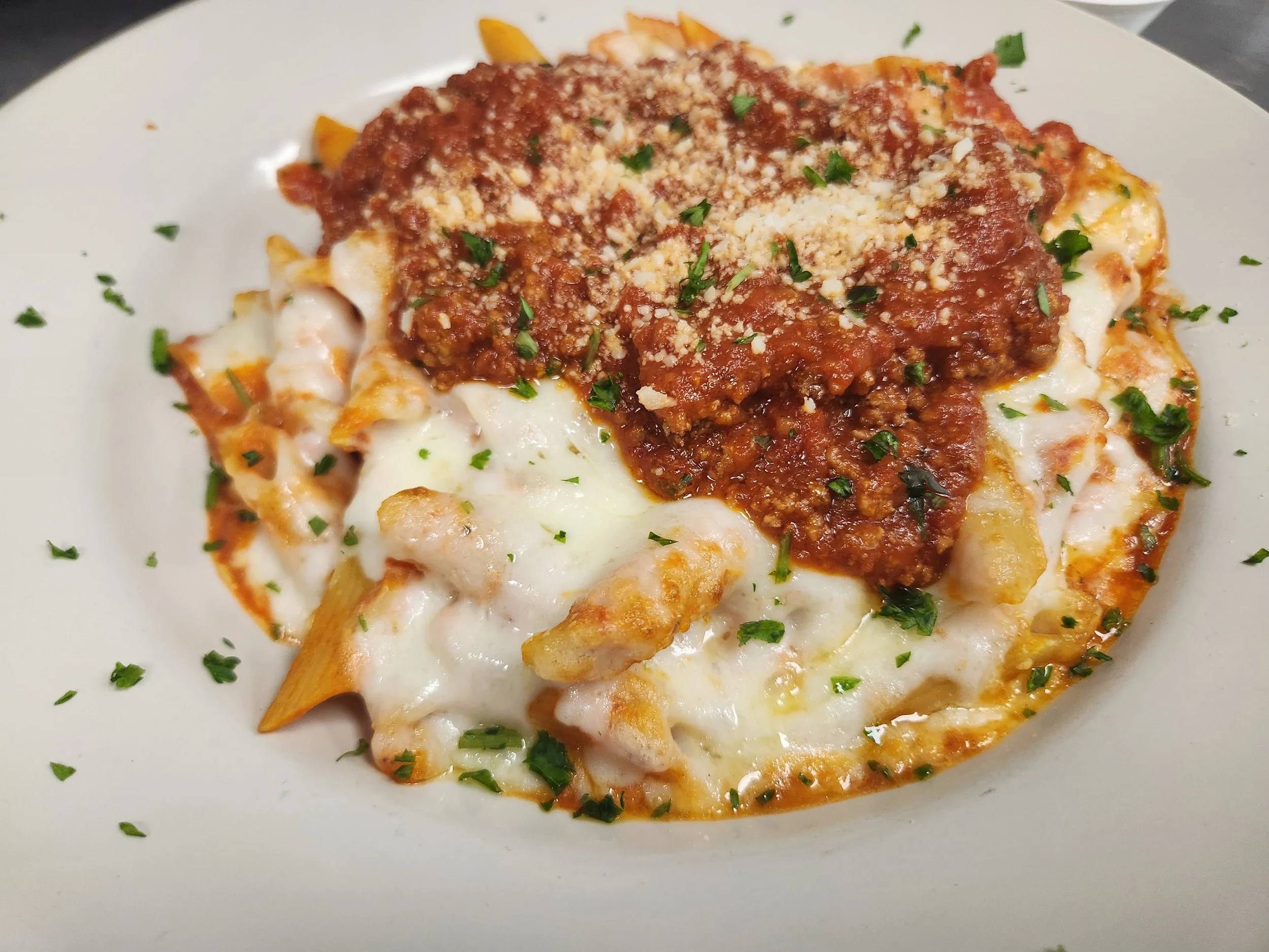 Baked ziti with marinara sauce and melted cheese
