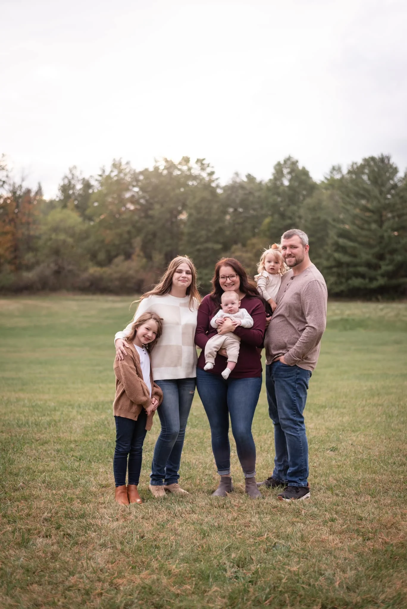 Family portrait in a park during autumn